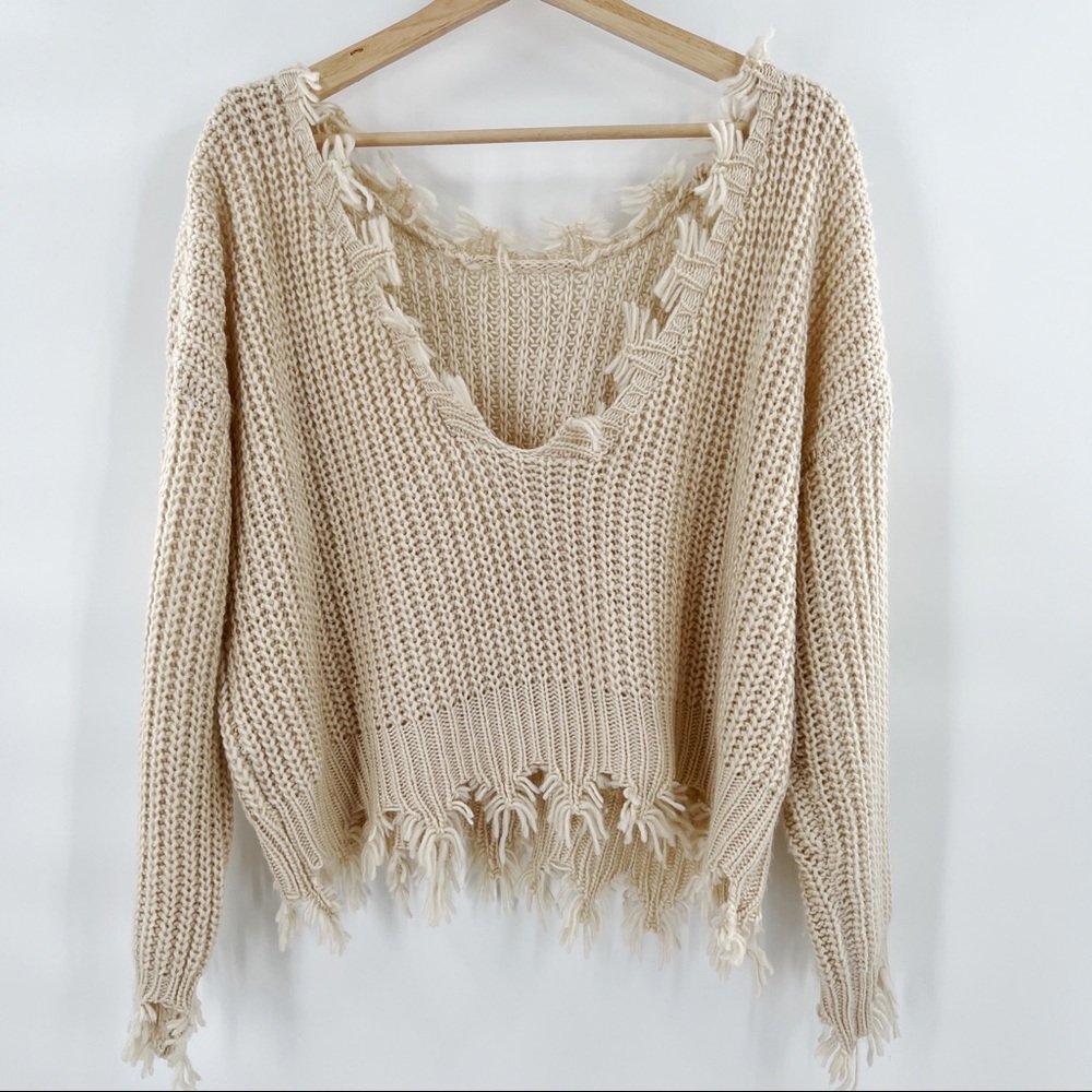 Storia distressed sweater two ways to wear